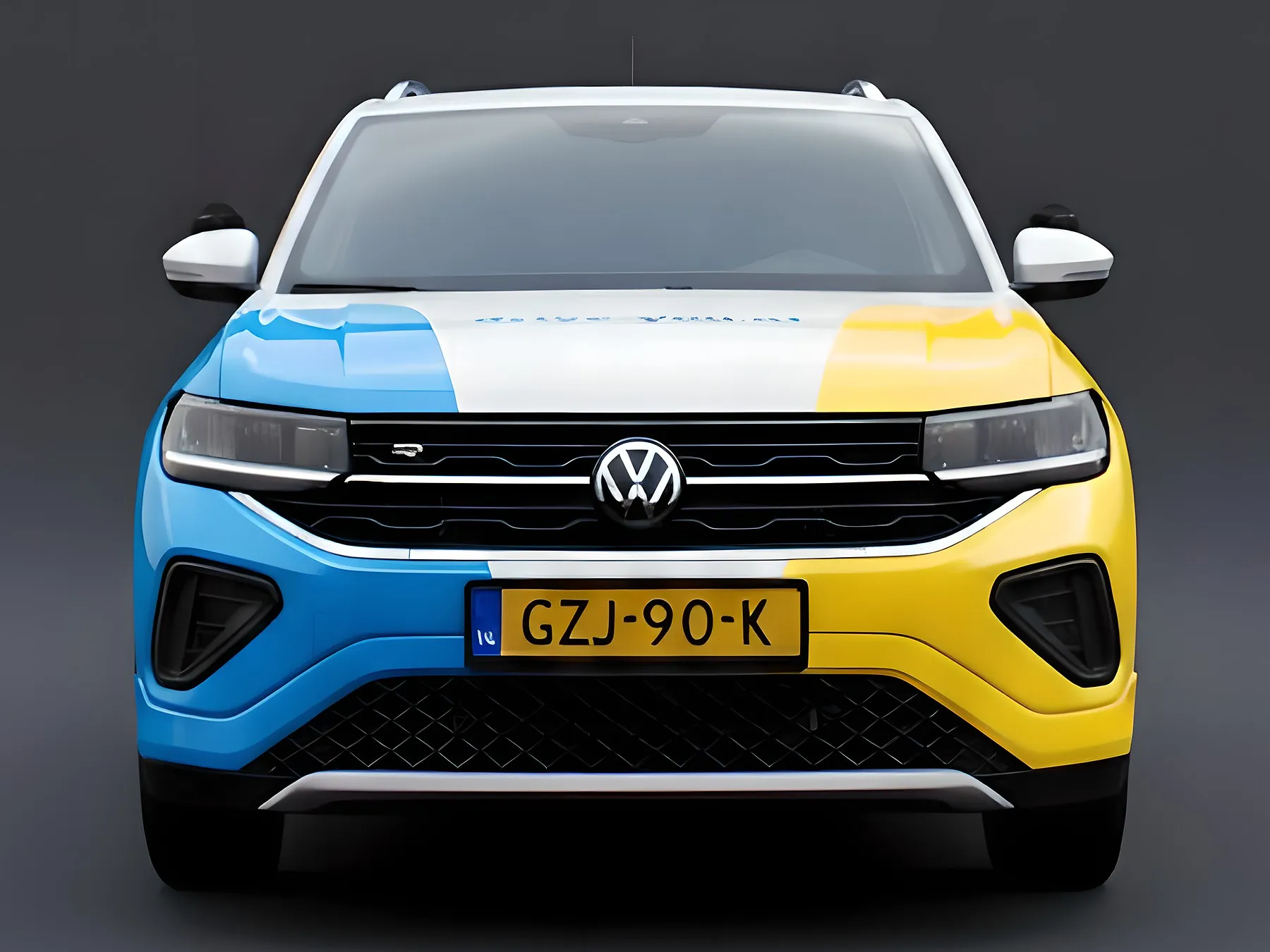 De lesauto van Rijschool Cobben, een Volkswagen T-Cross met drive.you-belettering, van voren