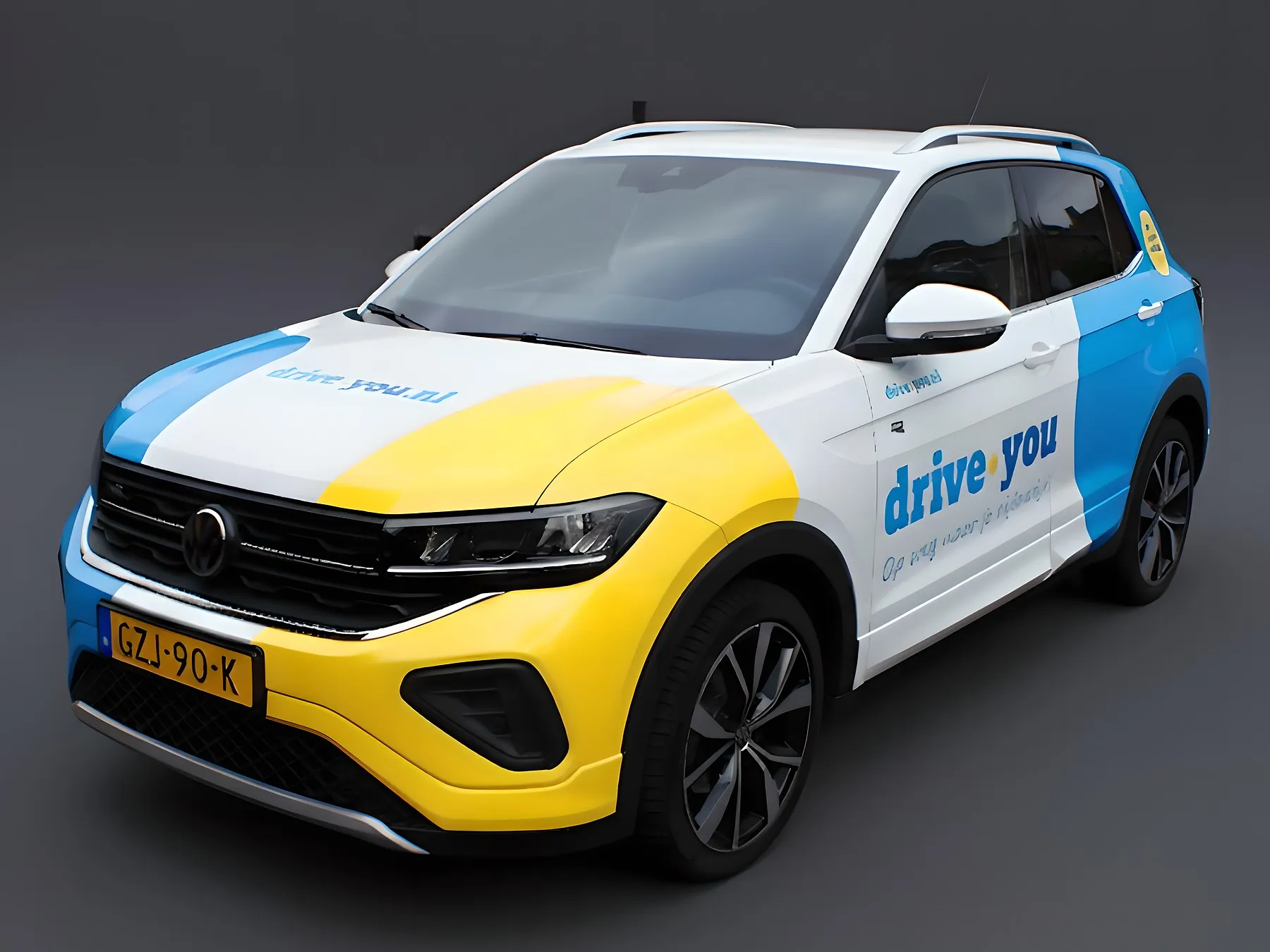 De lesauto van Rijschool Cobben, een Volkswagen T-Cross met drive.you-belettering, van linksvoor